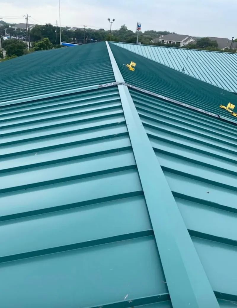 Green commercial metal roof ridge and valley for Metal Roof Repair in Baldwinsville